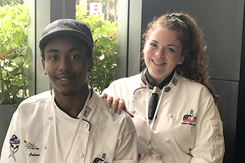 Two student chefs posing for a photo