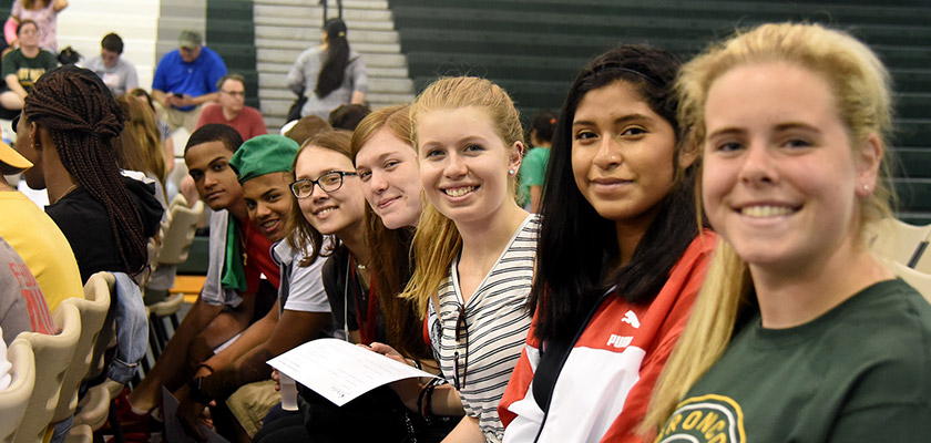 Students attending an orientation event in the field house